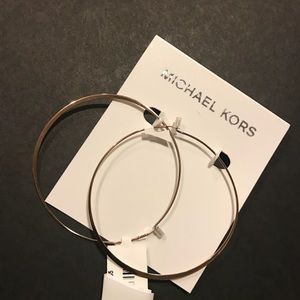 Michael Kors Rose gold hoop earrings.